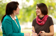 a counselor meeting with a young woman