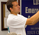 Man doing emergency planning, pointing to a white board