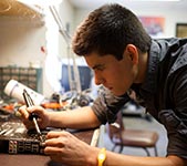 A man repairing an electronic device